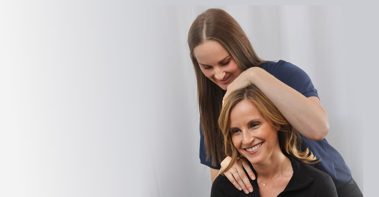 Chiropractor adjusting patients neck