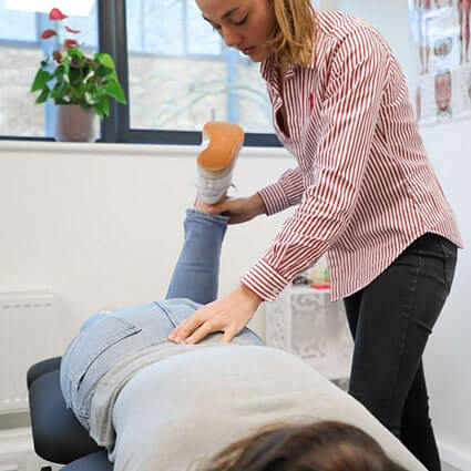 Giulia checking patients leg