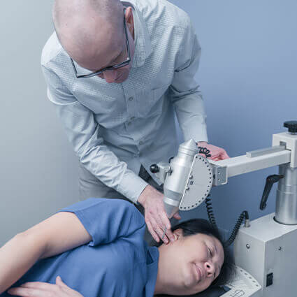 Dr. Richie with patient receiving treatment