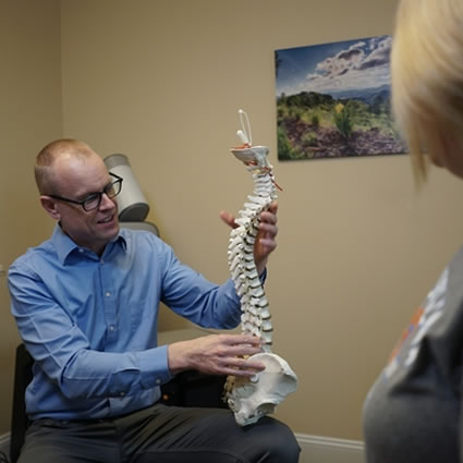 Dr. Ritchie with spine model