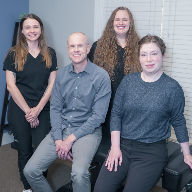Team sitting on adjusting table