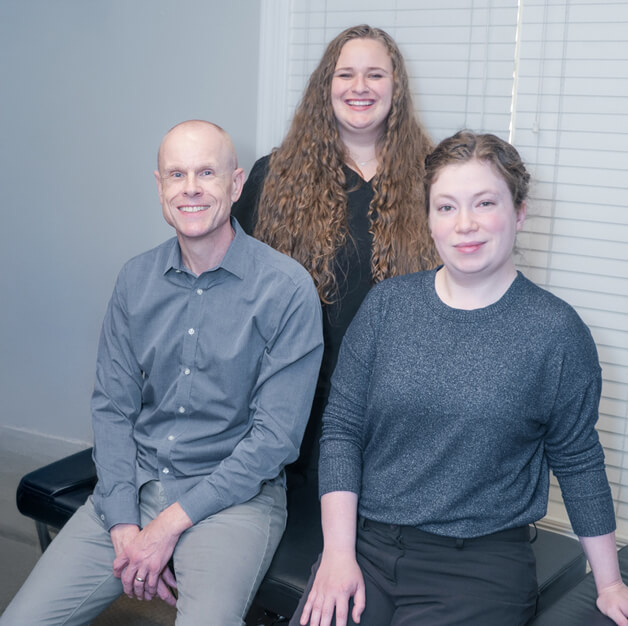 Team sitting on adjusting table