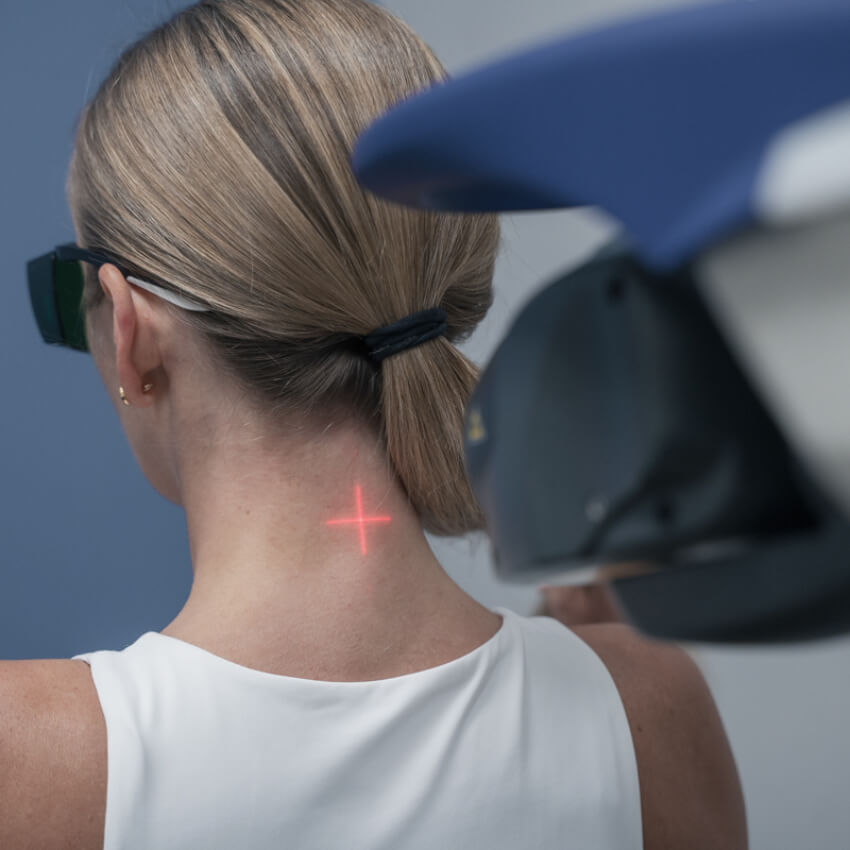 patient during laser therapy at Ritchie Chiropractic & Wellness