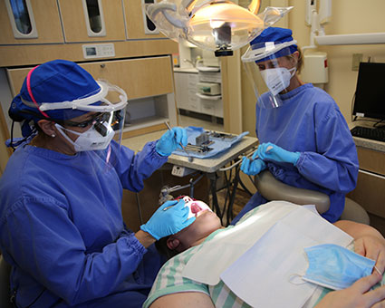 Dentist working on patients teeth