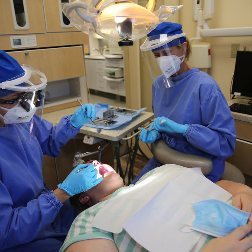 Crafton Dental team working on womans teeth
