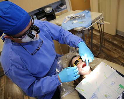 Dentist checking childs teeth