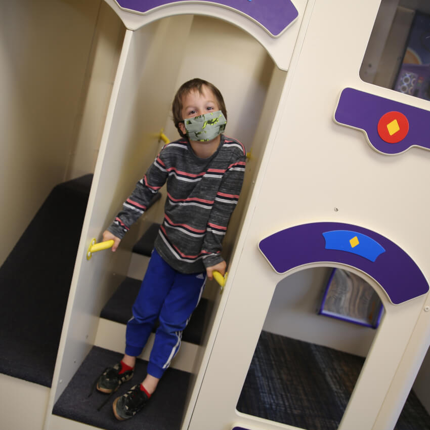 kid playing in our play area