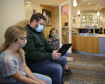 Family filling out paperwork