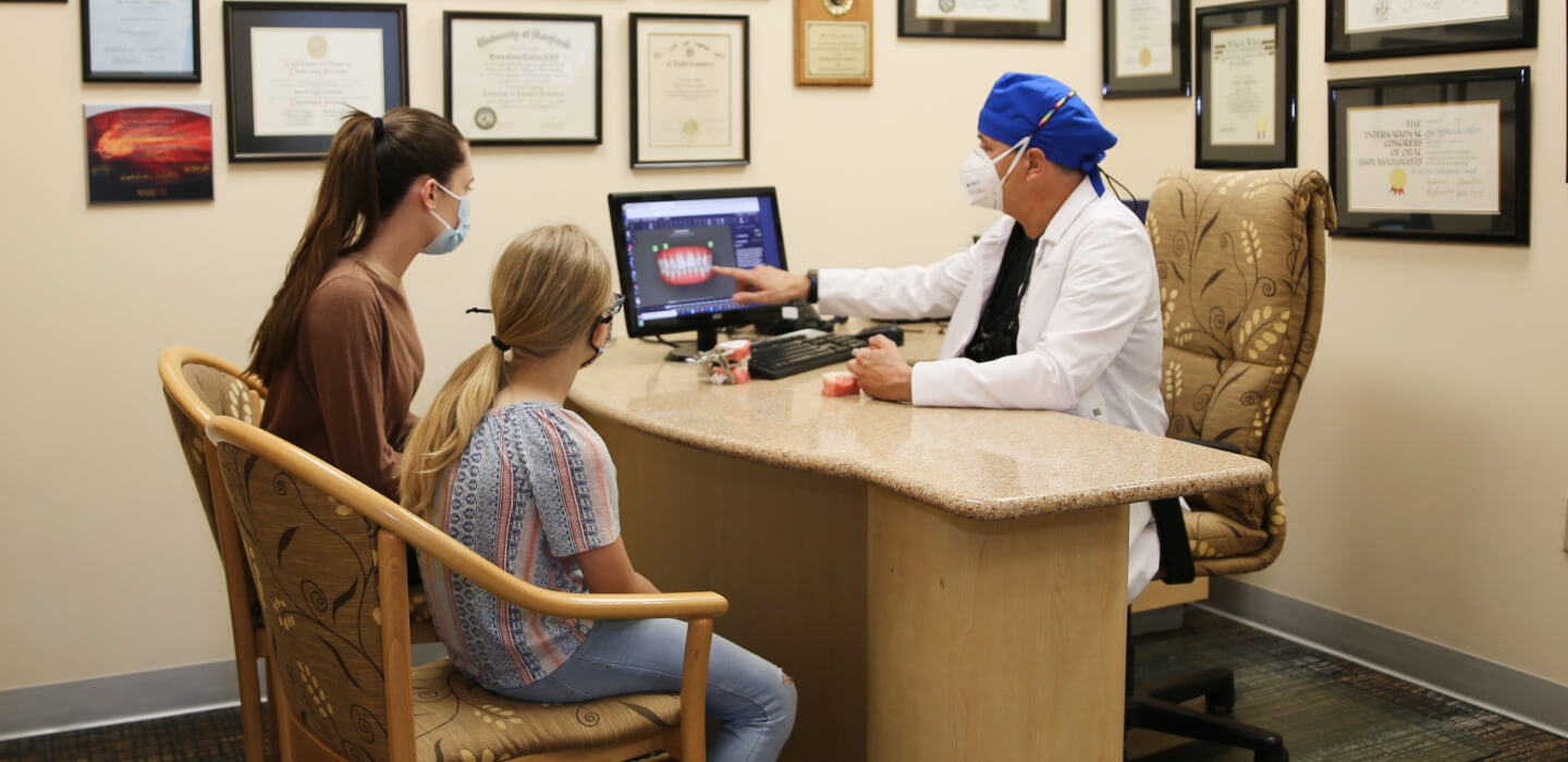 Dentist pointing screen