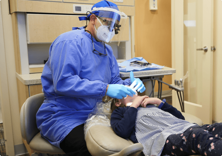 Dentist checking patient