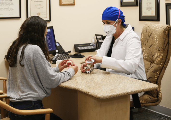 Patient consulting Dentist