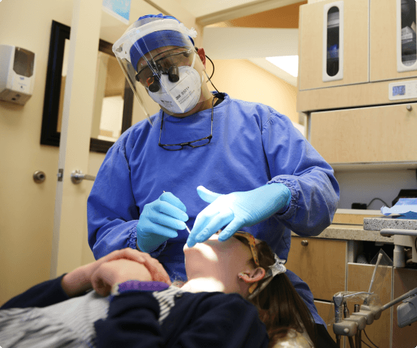 Dentist checking patient