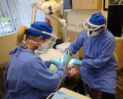 Staff working on patient