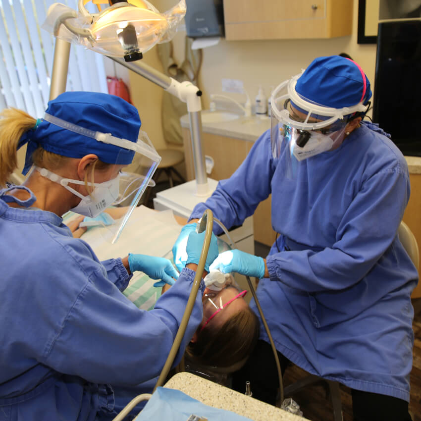 Columbia dentists working on female patient