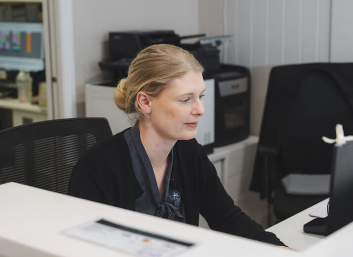 staff looking at computer