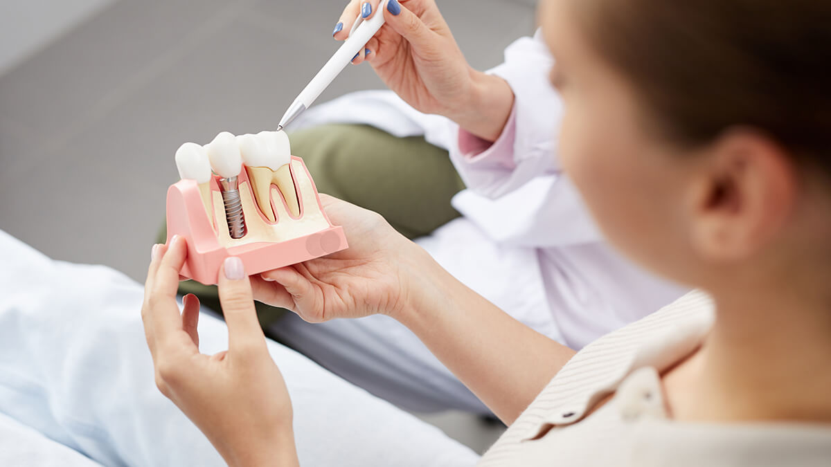 Patient holding implant illustration
