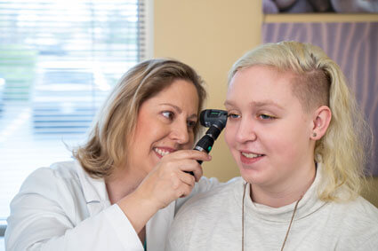 Dr. Perrin examining patient