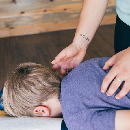 Boy face down on adjusting table