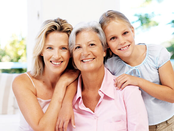 three generations of women smiling