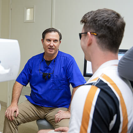 Dr Lauf and patient smiling