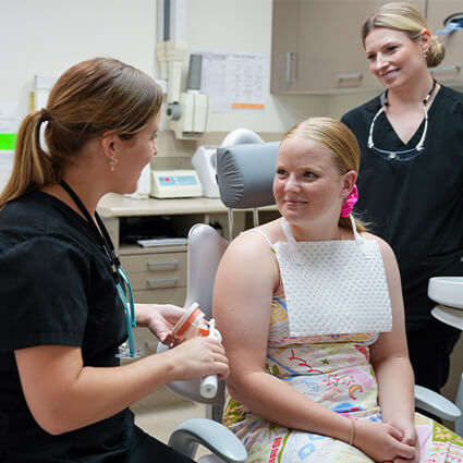 Staff talking with patient