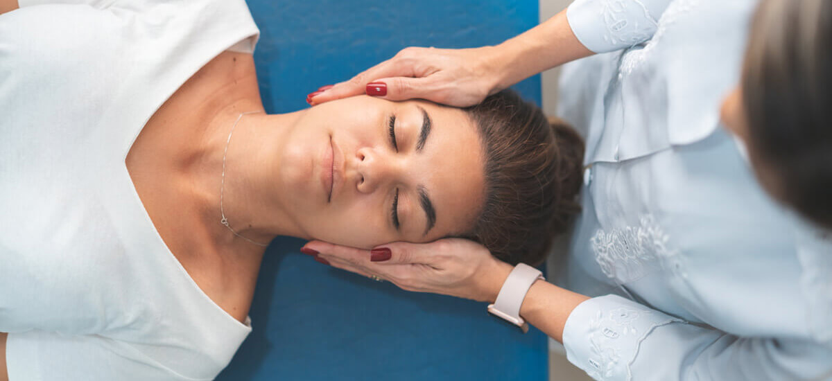 person having neck adjusted