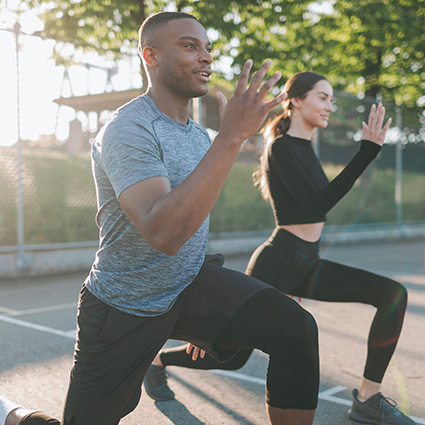 two people working out outdoors