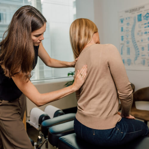 Upper-back adjustment for female patient