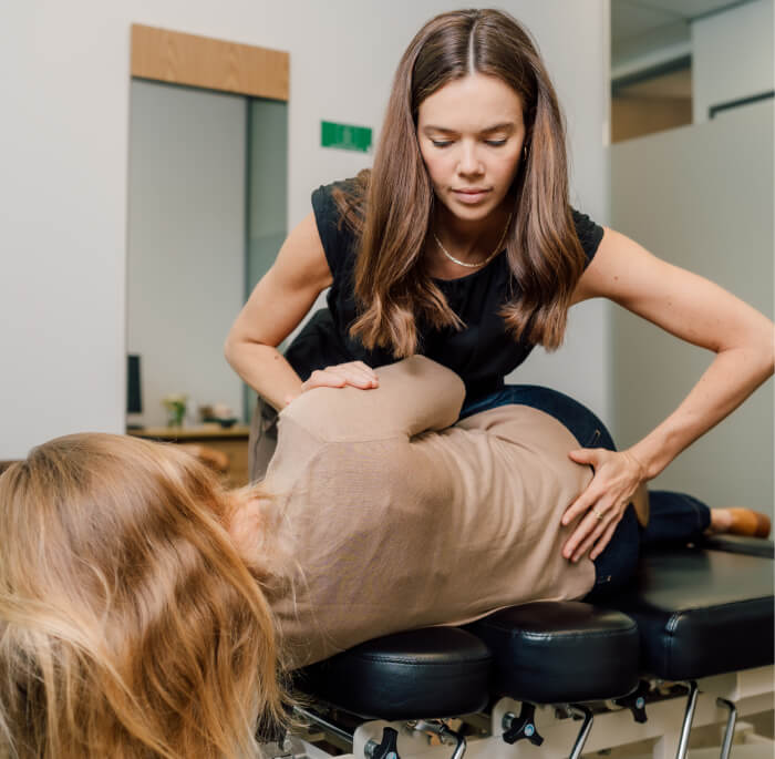 Chiropractor adjusting patient