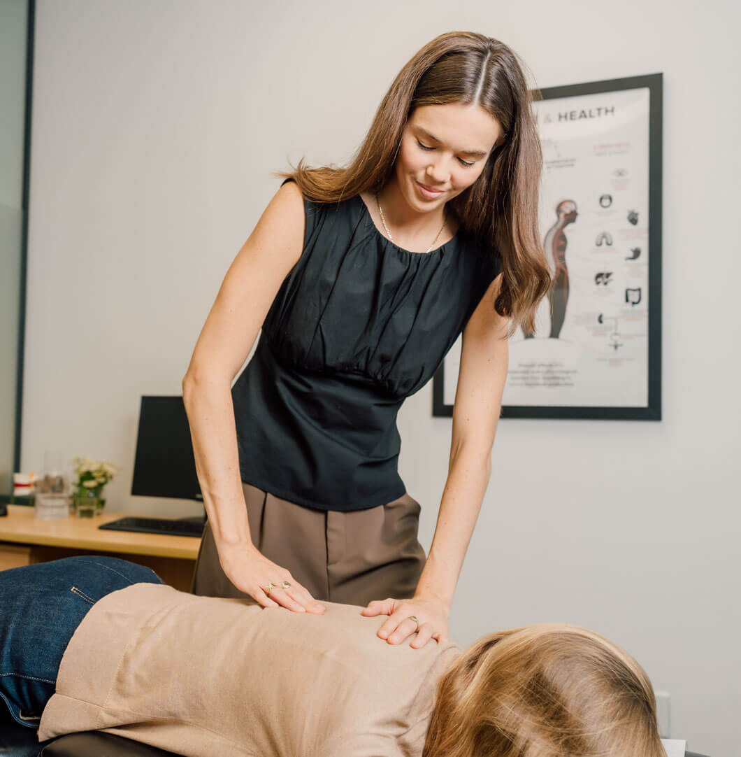 Chiropractor adjusting a patient