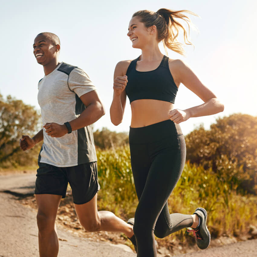 man and woman runner in nature