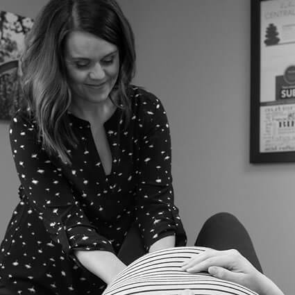 Dr. Maggie adjusting pregnant mom