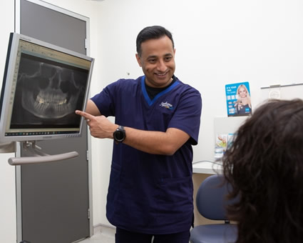 Dentist pointing to xray