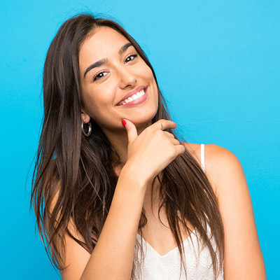 girl smiling blue background