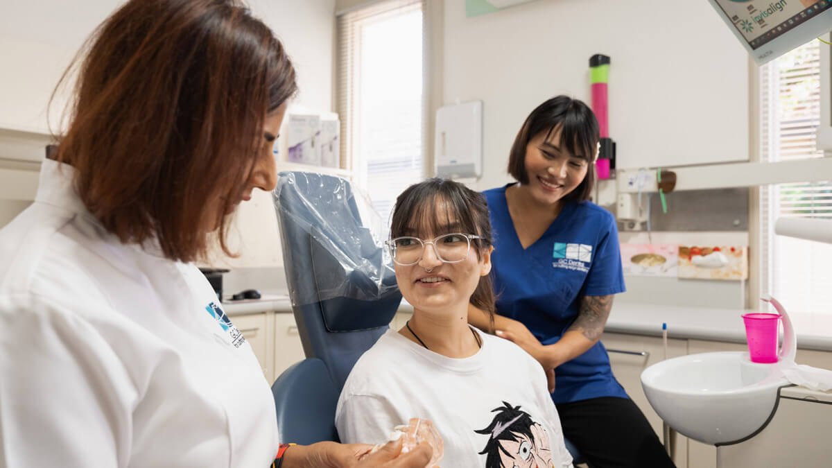 Dr Mita of GC Dental treating female patient