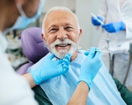 man smiling in dental chair