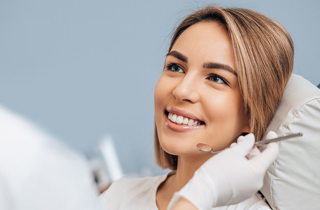 Woman sitting in dental chair