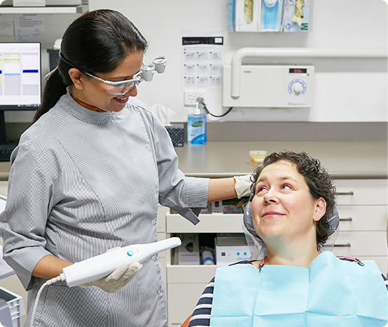 dentist looking at patient