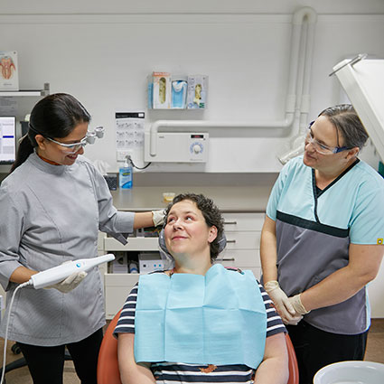 Woman looking up at dentist