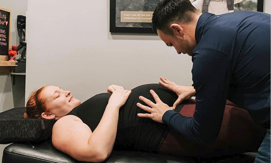 doctor adjusting pregnant lady