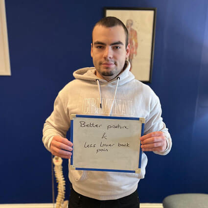 man holding posture sign