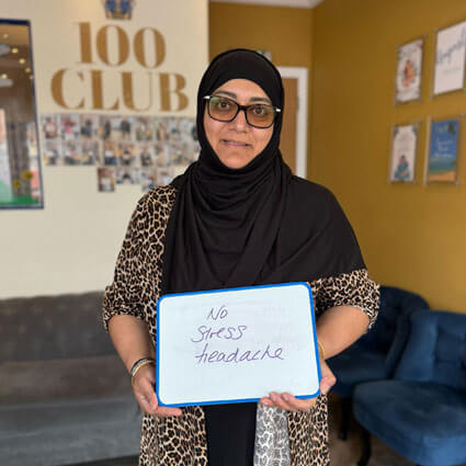 Woman holding stress sign