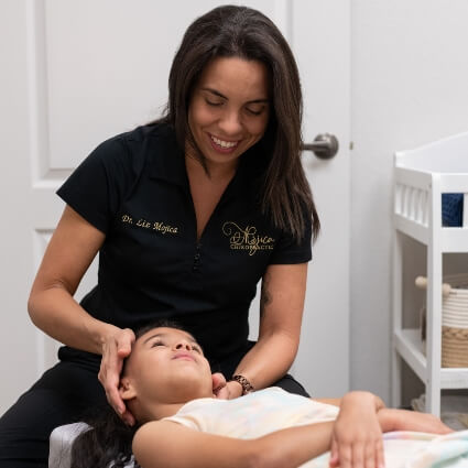 Dr Liz adjusting child's neck