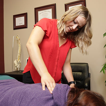 Doctor adjusting patients back