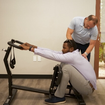 Patient using equipment to stretch