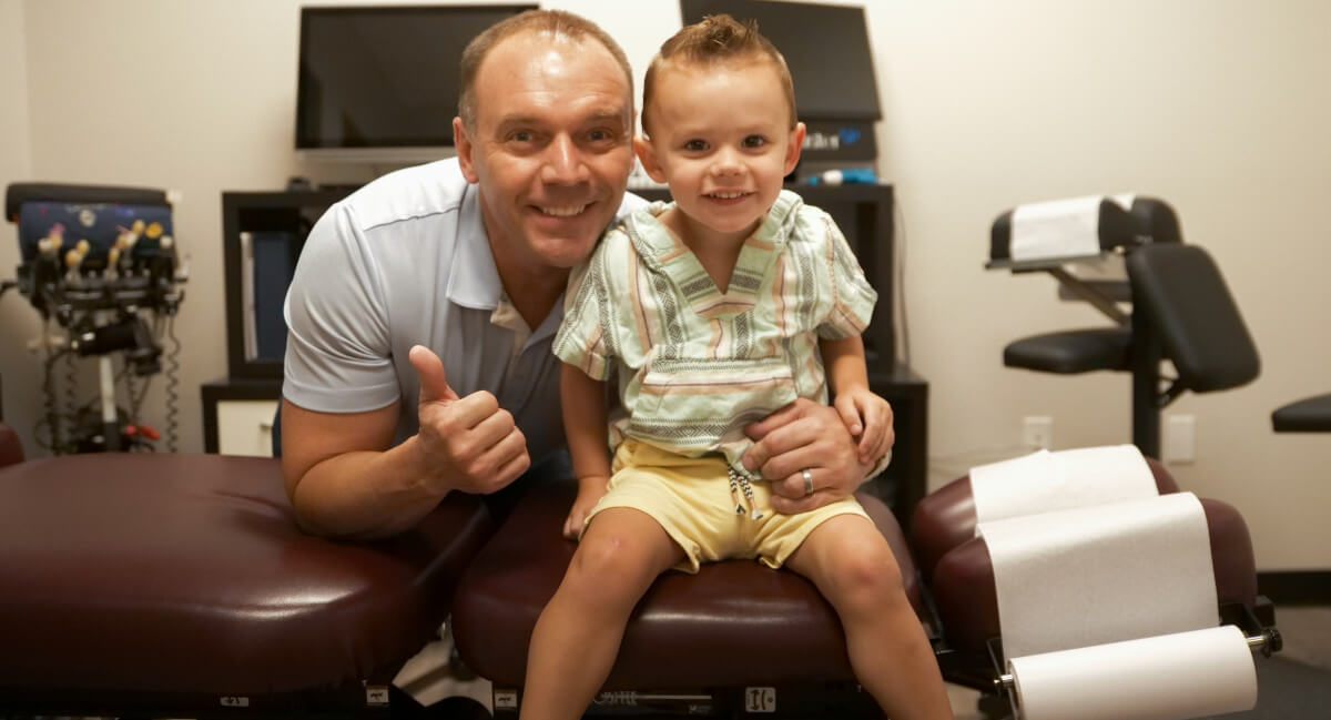 Dr. Roderick posing with pediatric patient