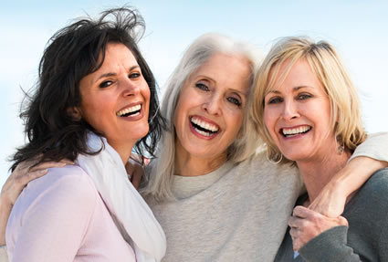Mature women wrapped arms around together smiling