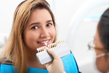 Woman checking veneer shades