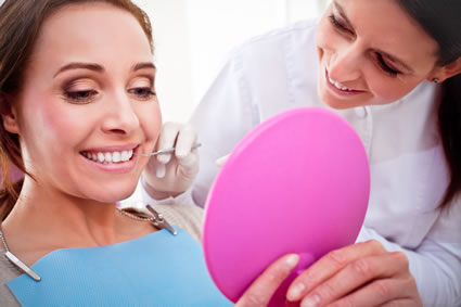 Woman on mirror at the dentist