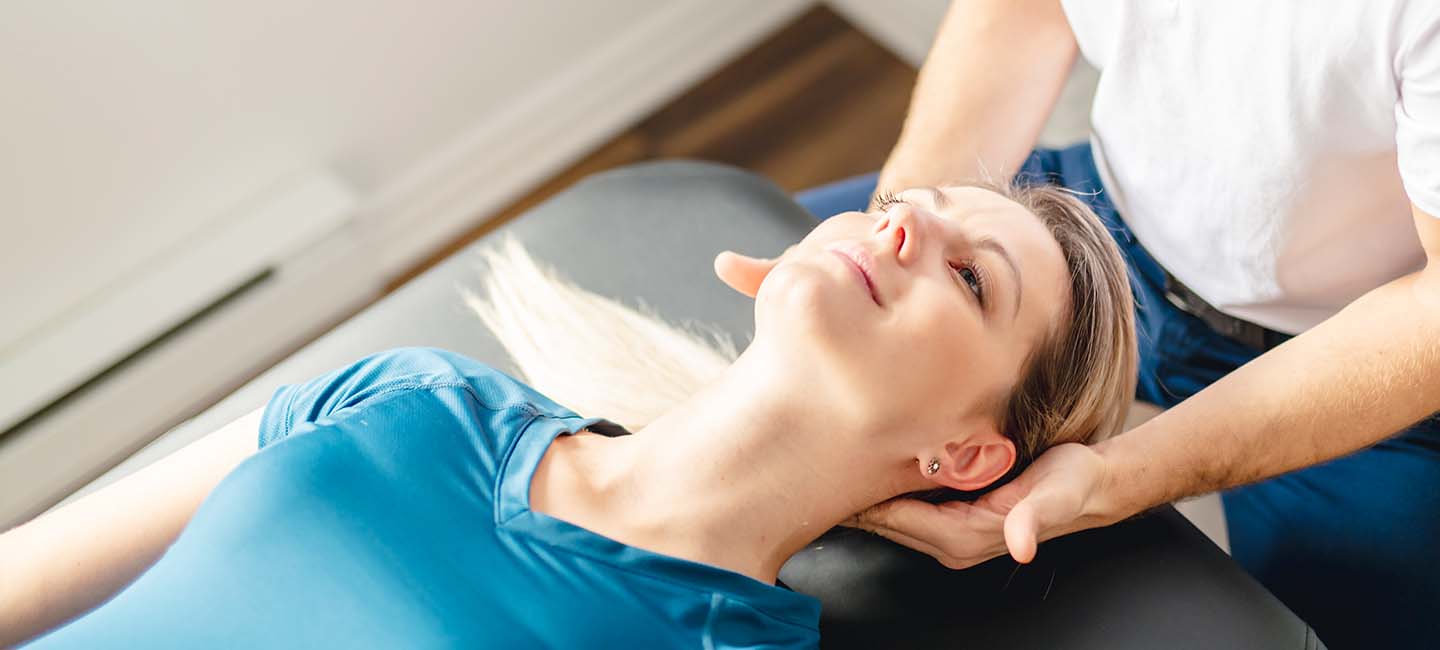 massaging woman's neck